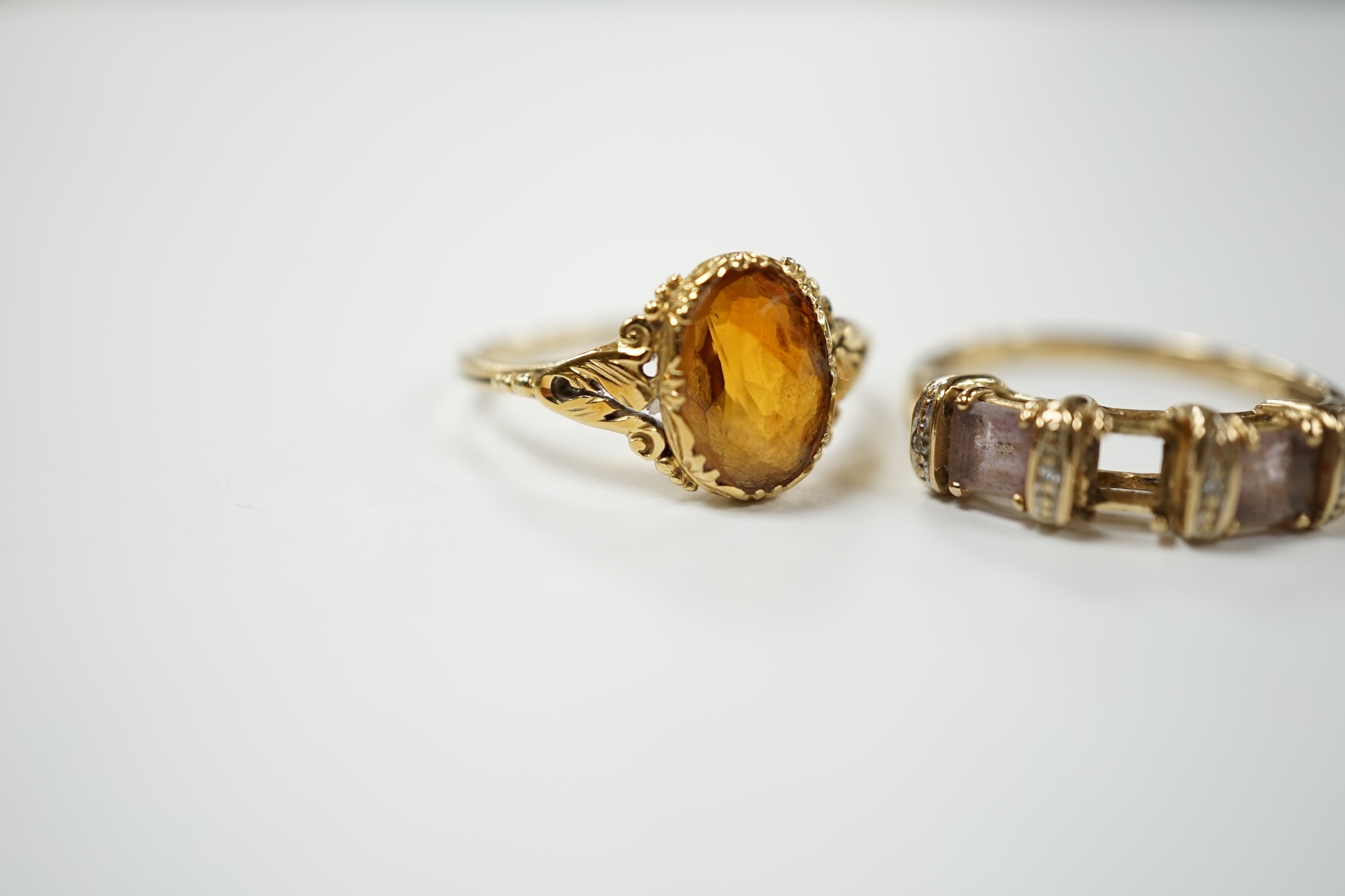 A 14k and single stone oval cut citrine set ring, size O, gross weight 2.8 grams and a modern 9ct gold and gem set ring (lacking stone), gross weight 2.3 grams. Condition - poor